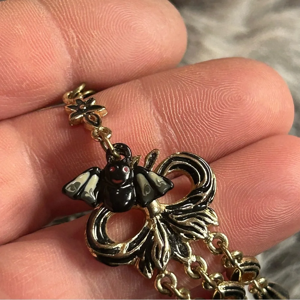 Handcrafted Cruella de Vil cameo bat accent pendant on chain necklace